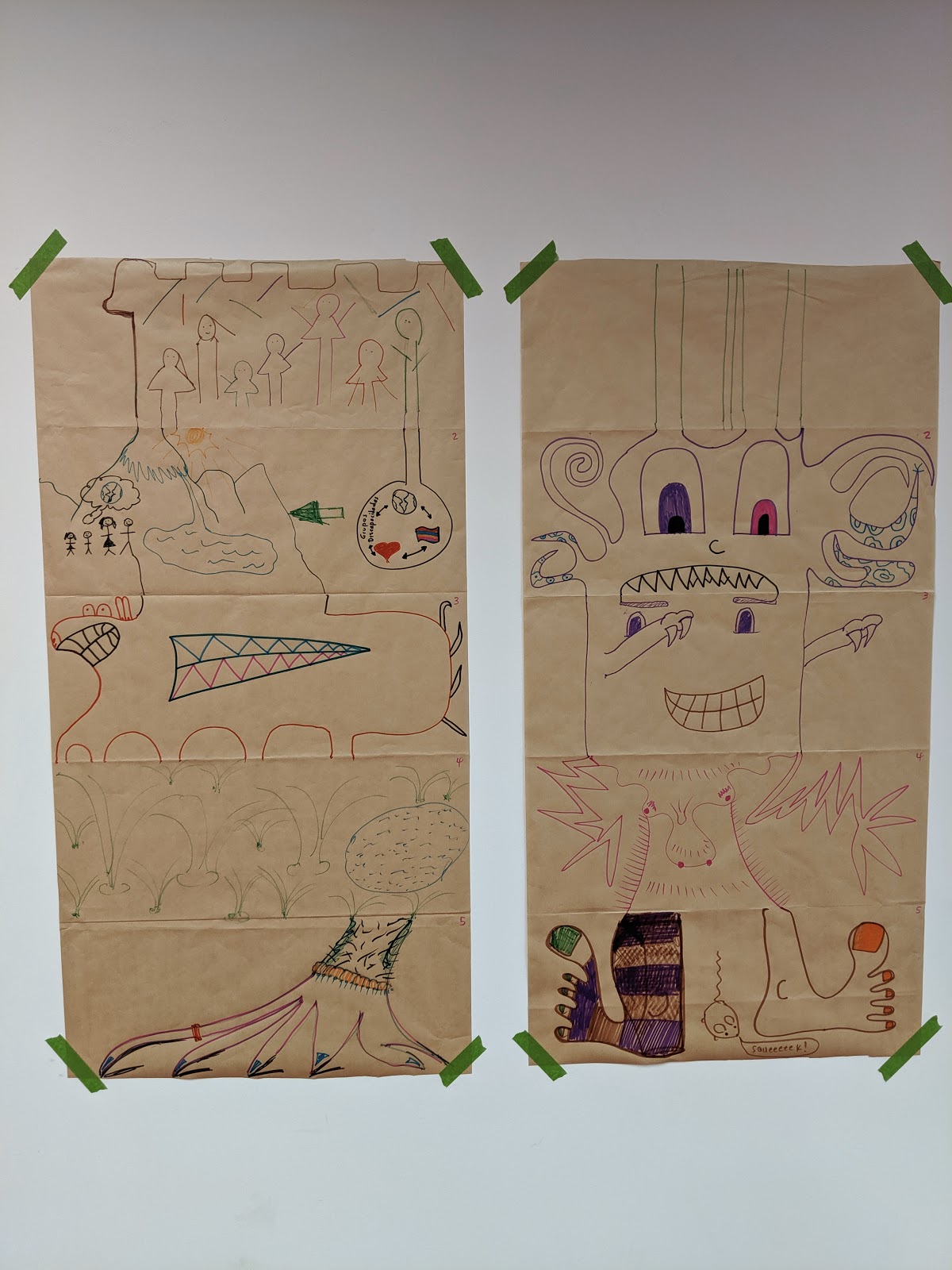 Two drawings of fantastical creatures made collaboratively by the project team.